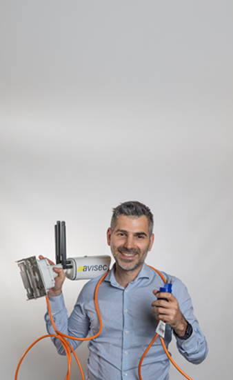 An image of a man holding an avisec construction camera, symbolising him being ready to install it.