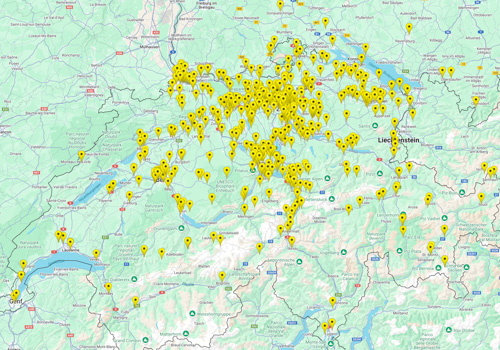 A map of Switzerland with yellow tooltips showing each active camera.