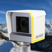 Avisec panorama webcam with weatherproof housing mounted in front of snowy mountains, used for live feeds or timelapse recording.